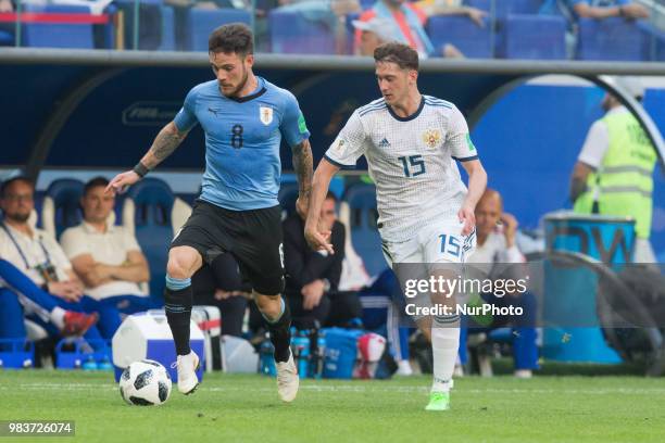 Nahitan Nandez of Uruguay vies Alexey Miranchuk of Russia during the 2018 FIFA World Cup Russia group A match between Uruguay and Russia at Samara...