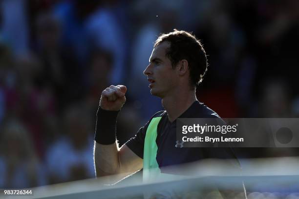 Andy Murray of Great Britain celebrates winning his first round match against Stan Wawrinka of Switzerland on day four of the Nature Valley...