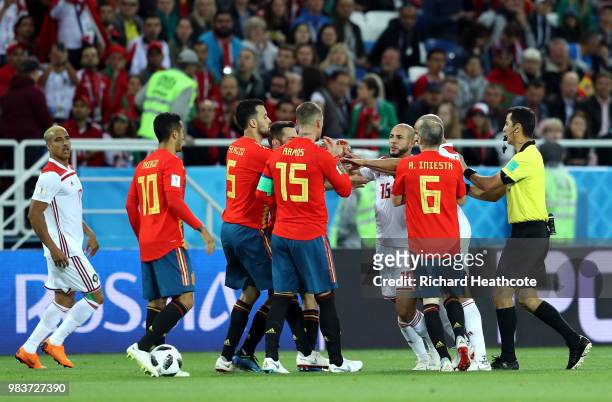 Noureddine Amrabat of Morocco confronts Sergio Ramos of Spain during the 2018 FIFA World Cup Russia group B match between Spain and Morocco at...