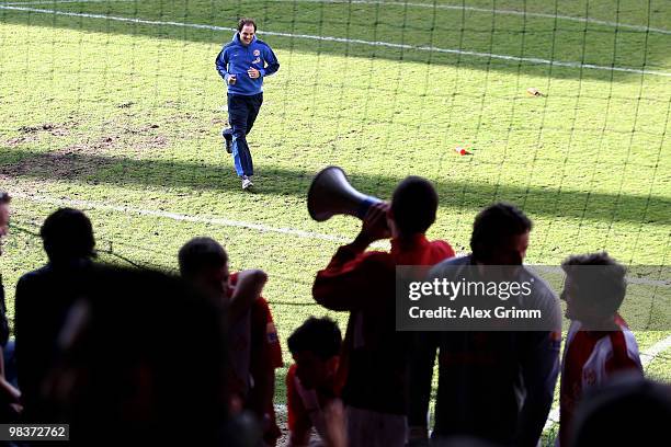 Head coach Thomas Tuchel of Mainz runs to the supporters after the Bundesliga match between FSV Mainz 05 and Borussia Dortmund at the Bruchweg...