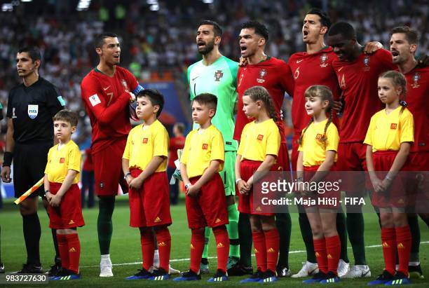 Cristiano Ronaldo, Rui Patricio, Pepe and Jose Fonte of Portugal sing the national anthem prior to the 2018 FIFA World Cup Russia group B match...