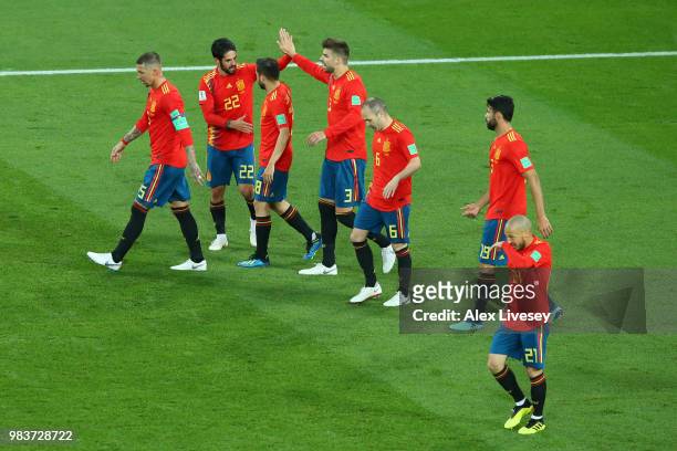 Isco celebrates with teammates after scoring his sides opening goal to make the score 1-1 during the 2018 FIFA World Cup Russia group B match between...
