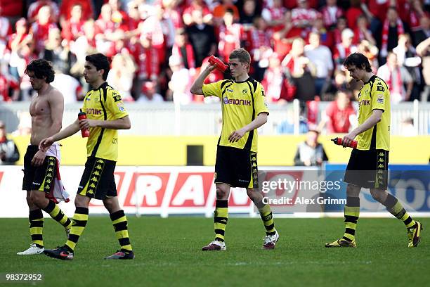 Nelson Valdez, Nuri Sahin, Sven Bender and Neven Subotic of Dortmund react after the Bundesliga match between FSV Mainz 05 and Borussia Dortmund at...