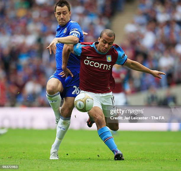 John Terry of Chelsea and Gabriel Agbonlahor of Aston Villa battle for the ball during the FA Cup sponsored by E.ON Semi Final match between Aston...