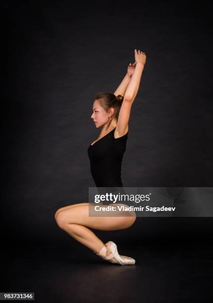 young,smiling girl dancing the ballet. studio shot - dancing studio shot stock pictures, royalty-free photos & images