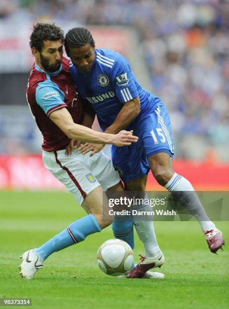 Carlos Cuellar of Aston Villa tangles with Florent Malouda of Chelsea during the FA Cup sponsored by E.ON Semi Final match between Aston Villa and...