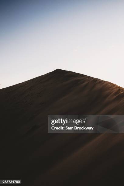 tiny silhouettes - sam sand dunes stock pictures, royalty-free photos & images