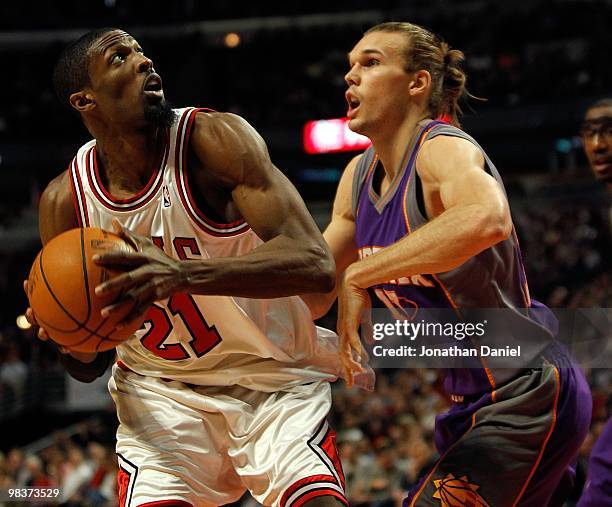 Hakim Warrick of the Chicago Bulls looks to shoot against Louis Amundson of the Phoenix Suns at the United Center on March 30, 2010 in Chicago,...