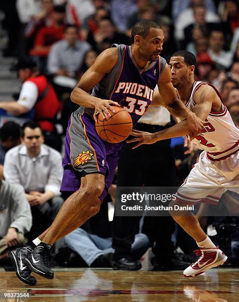 Grant Hill of the Phoenix Suns drives against Jannero Pargo of the Chicago Bulls at the United Center on March 30, 2010 in Chicago, Illinois. The...