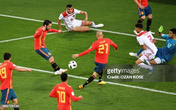 Spain's midfielder Isco kicks to score their first goal during the Russia 2018 World Cup Group B football match between Spain and Morocco at the...