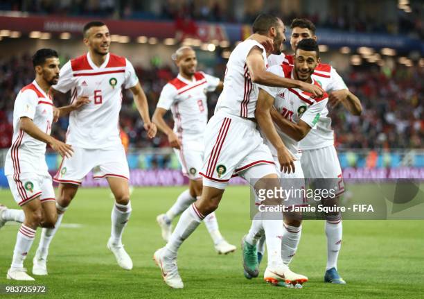 Khalid Boutaib of Morocco celebrates with teammates after scoring his team's first goal during the 2018 FIFA World Cup Russia group B match between...