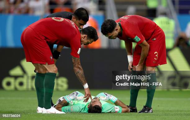 Rui Patricio of Portugal lies on the pitch injured during the 2018 FIFA World Cup Russia group B match between Iran and Portugal at Mordovia Arena on...