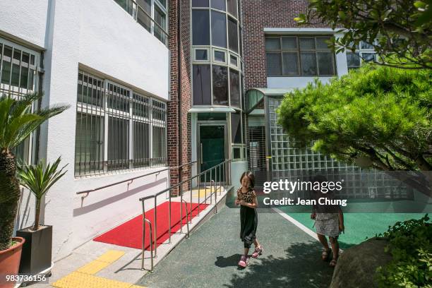 Children walk inside Hyoseong Elementary School, which used to be a POW camp during the Korean War, on June 24, 2018 in DAEGU, South Korea. Over...