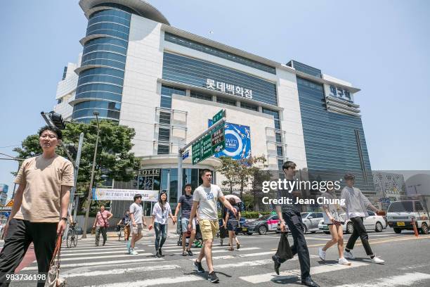 Pedestrians walk in front of Daegu train station, on June 24, 2018 in DAEGU, South Korea. Over 66,000 South Koreans have been separated from their...