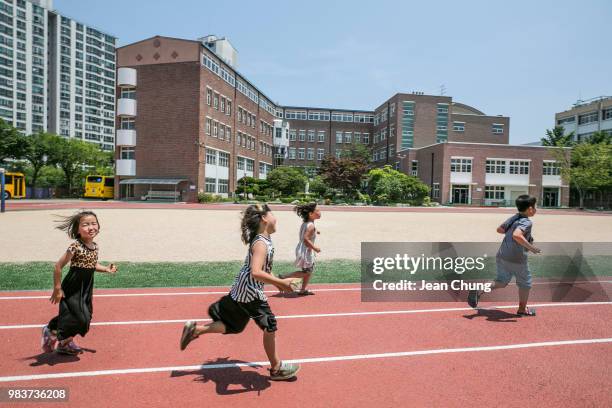 Children run inside Hyoseong Elementary School, which used to be a POW camp during the Korean War, on June 24, 2018 in DAEGU, South Korea. Over...