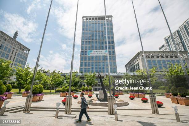Man walks in front of Busan City Hall, which used to be a POW camp during the Korean War, on June 23, 2018 in BUSAN, South Korea. Over 66,000 South...