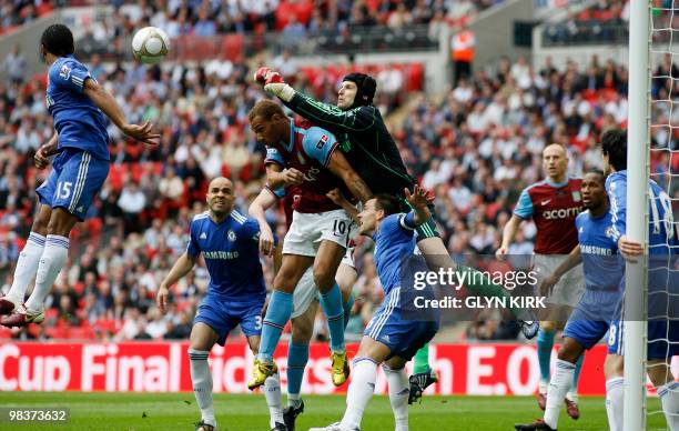 Chelsea's Czech goalkeeper Petr Cech manages to keep the ball away during the FA Cup semi-final football match against Aston Villa at Wembley...
