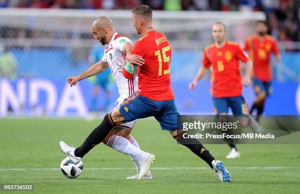 Sergio Ramos of Spain competes with Noureddine Amrabat of Morocco during the 2018 FIFA World Cup Russia group B match between Spain and Morocco at...
