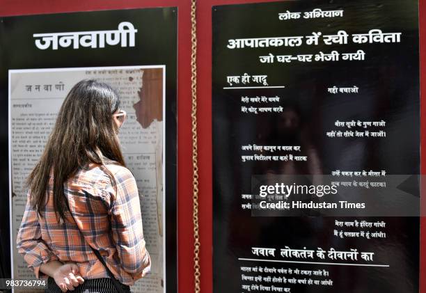 Woman looks at an exhibition on the Emergency which displayed news clippings and letters exchanged between arrested political leaders during the...