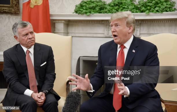 President Donald Trump speaks as King Abdullah II looks on during a meeting in the Oval Office of the White House on June 25, 2018 in Washington, DC.