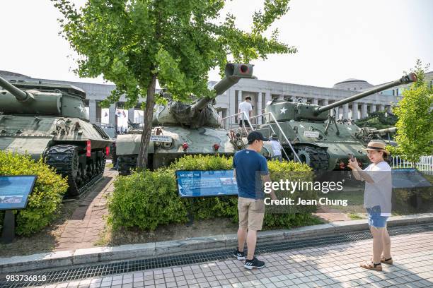 South Korean family walks past the tanks which were used during the Korean War at the War Memorial of Korea, on June 24, 2018 in SEOUL, South Korea....