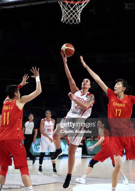 Melike Bakircioglu of Turkey in action against Si-Jing Huang and Xu Han of China during the friendly women's basketball match between Turkey and...