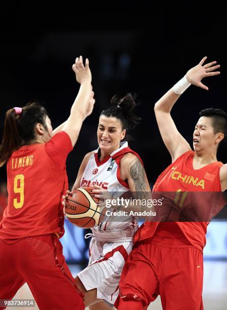 Melike Bakircioglu of Turkey in action against Si-Jing Huang and Meng Li of China during the friendly women's basketball match between Turkey and...