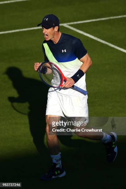 Andy Murray of Great Britain celebrates winning a set during his mens singles match against Stan Wawrinka of Switzerland during Day Four of the...