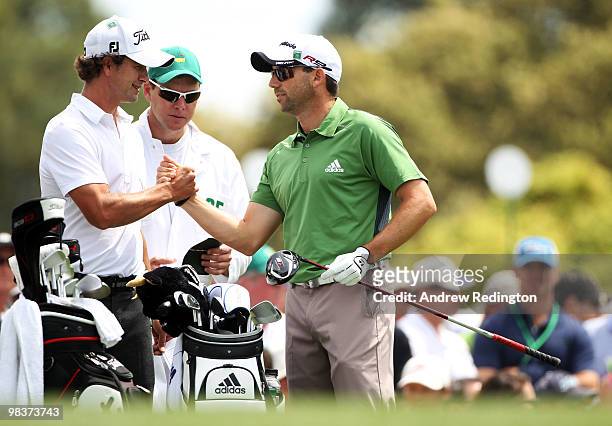 Adam Scott of Australia greets Sergio Garcia of Spain on the first tee during the third round of the 2010 Masters Tournament at Augusta National Golf...