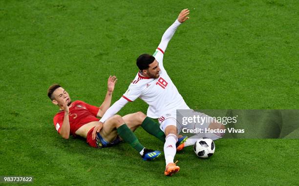 Alireza Jahanbakhsh of Iran is fouled by Raphael Guerreiro of Portugal during the 2018 FIFA World Cup Russia group B match between Iran and Portugal...