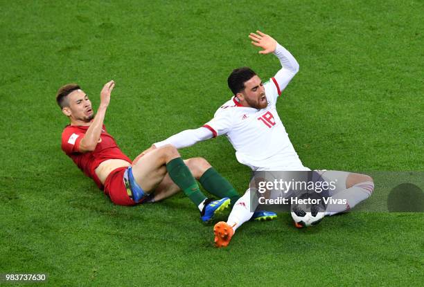 Alireza Jahanbakhsh of Iran is fouled by Raphael Guerreiro of Portugal during the 2018 FIFA World Cup Russia group B match between Iran and Portugal...