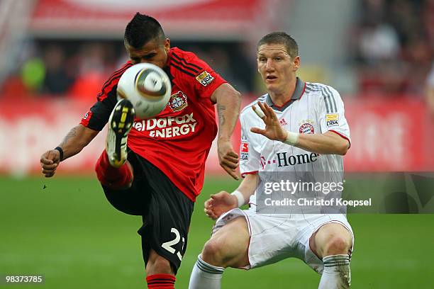 Bastian Schweinsteiger of Bayern challenges Arturo Vidal of Leverkusen during the Bundesliga match between Bayer Leverkusen and FC Bayern Muenchen at...