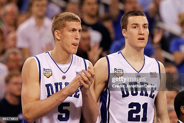 Mason Plumlee and Miles Plumlee of the Duke Blue Devils support their teammates from the bench against the Butler Bulldogs during the 2010 NCAA...