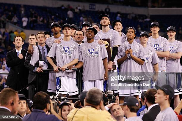 The Duke Blue Devils watch CBS 's presentation of "One Shining Moment" as they celebrate after they won 61-59 against the Butler Bulldogs during the...