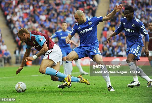 John Carew of Aston Villa is tackled by Alex of Chelsea during the FA Cup sponsored by E.ON Semi Final match between Aston Villa and Chelsea at...