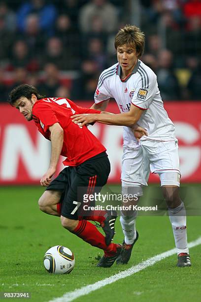 Gonzalo Castro of Leverkusen challenges Holger Badstuber of Bayern during the Bundesliga match between Bayer Leverkusen and FC Bayern Muenchen at the...