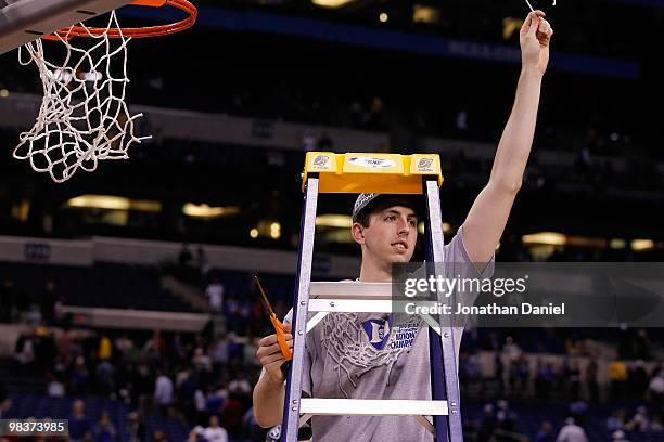 Ryan Kelly of the Duke Blue Devils celebrates after he cut down a piece of the net following their 61-59 win against the Butler Bulldogs during the...