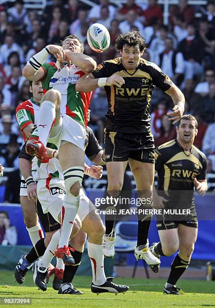 Biarritz's centre Damien Traille vies with Ospreys' James Hook during their rugby union European Cup quarter final match Biarritz-Neath-Swansea's...