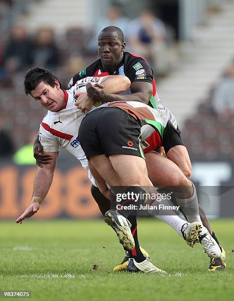 Chris Flannery of St Helens is tackled by Lamont Bryan of Quins during the Engage Super League match between Harlequins and St Helens at The Stoop on...