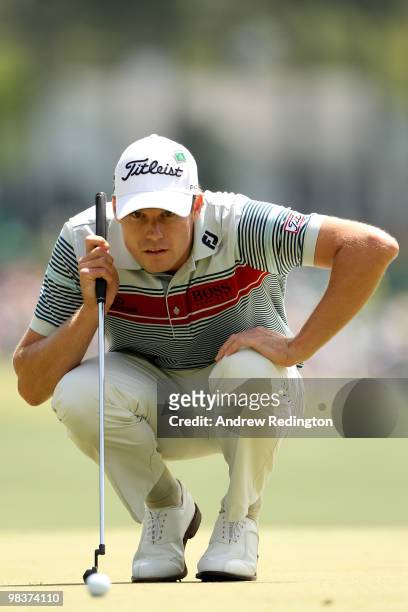 Nick Watney lines up a putt on the first green during the third round of the 2010 Masters Tournament at Augusta National Golf Club on April 10, 2010...