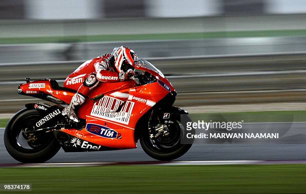 Ducati Marlboro Team's Nicky Hayden of the US races during the 2010 MotoGP free practice at the Losail International Circuit in Doha on April 10,...
