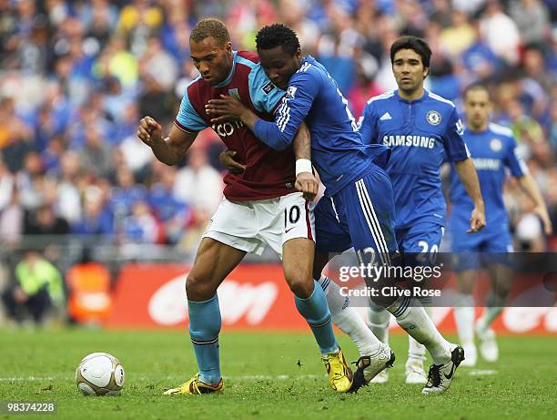 John Carew of Aston Villa tries to holds back Jon Obi Mikel of Chelsea during the FA Cup sponsored by E.ON Semi Final match between Aston Villa and...