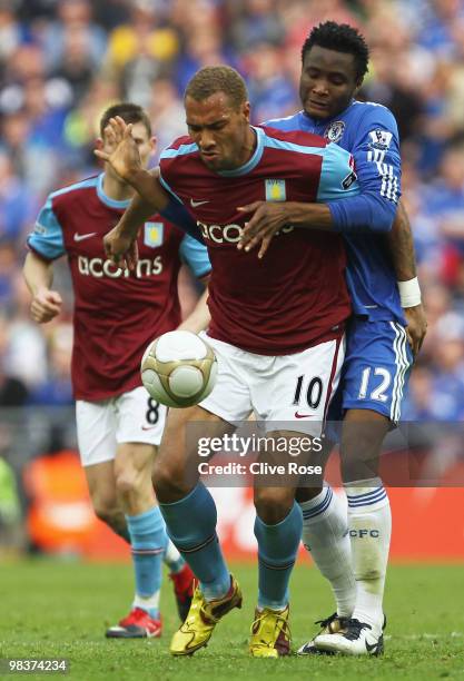 John Carew of Aston Villa tries to holds back Jon Obi Mikel of Chelsea during the FA Cup sponsored by E.ON Semi Final match between Aston Villa and...