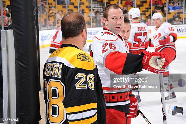 Mark Recchi of the Boston Bruins chats with Erik Cole of the Carolina Hurricanes during warmups at the TD Garden on April 10, 2010 in Boston,...