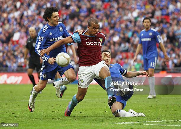 Gabriel Agbonlahor of Aston Villa is tackled by Yuri Zhirkov and John Terry of Chelsea during the FA Cup sponsored by E.ON Semi Final match between...