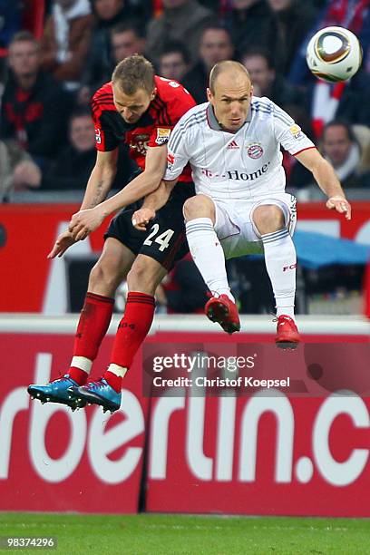 Michal Kadlec of Leverkusen and Arjen Robben of Bayern go up for a header during the Bundesliga match between Bayer Leverkusen and FC Bayern Muenchen...