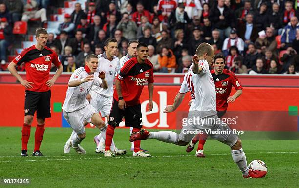 Bayern's Arjen Robben scores from a penalty kick his team's first goal during the Bundesliga match between Bayer Leverkusen and FC Bayern Muenchen at...