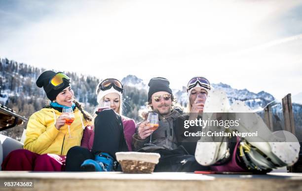 group of friends having fun in a ski resort - ski party stock pictures, royalty-free photos & images