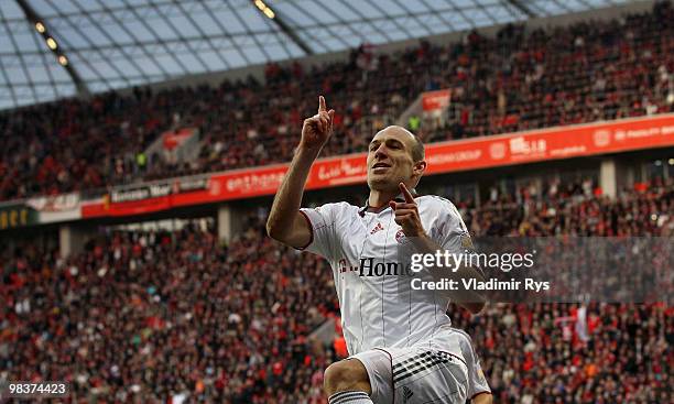 Bayern's Arjen Robben celebrates after scoring from a penalty kick his team's first goal during the Bundesliga match between Bayer Leverkusen and FC...