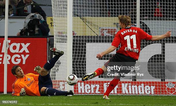 Stefan Kiessling of Leverkusen shoots as Joerg Butt of Bayern lays on the pitch during the Bundesliga match between Bayer Leverkusen and FC Bayern...